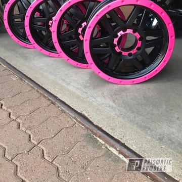Two Tone 4x4 Wheels In A Pink And Black Powder Coat