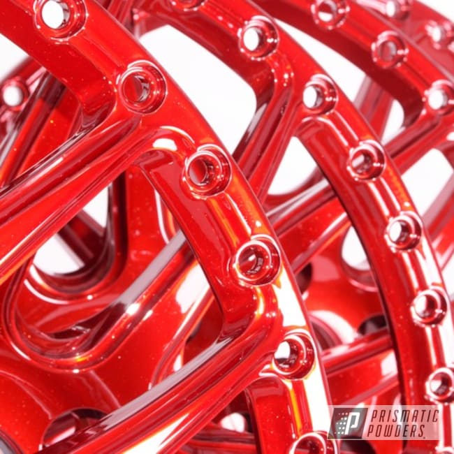 https://images.nicindustries.com/prismatic/projects/11889/powder-coated-metallic-red-rim-faces-thumbnail.jpg?1554243402&size=650