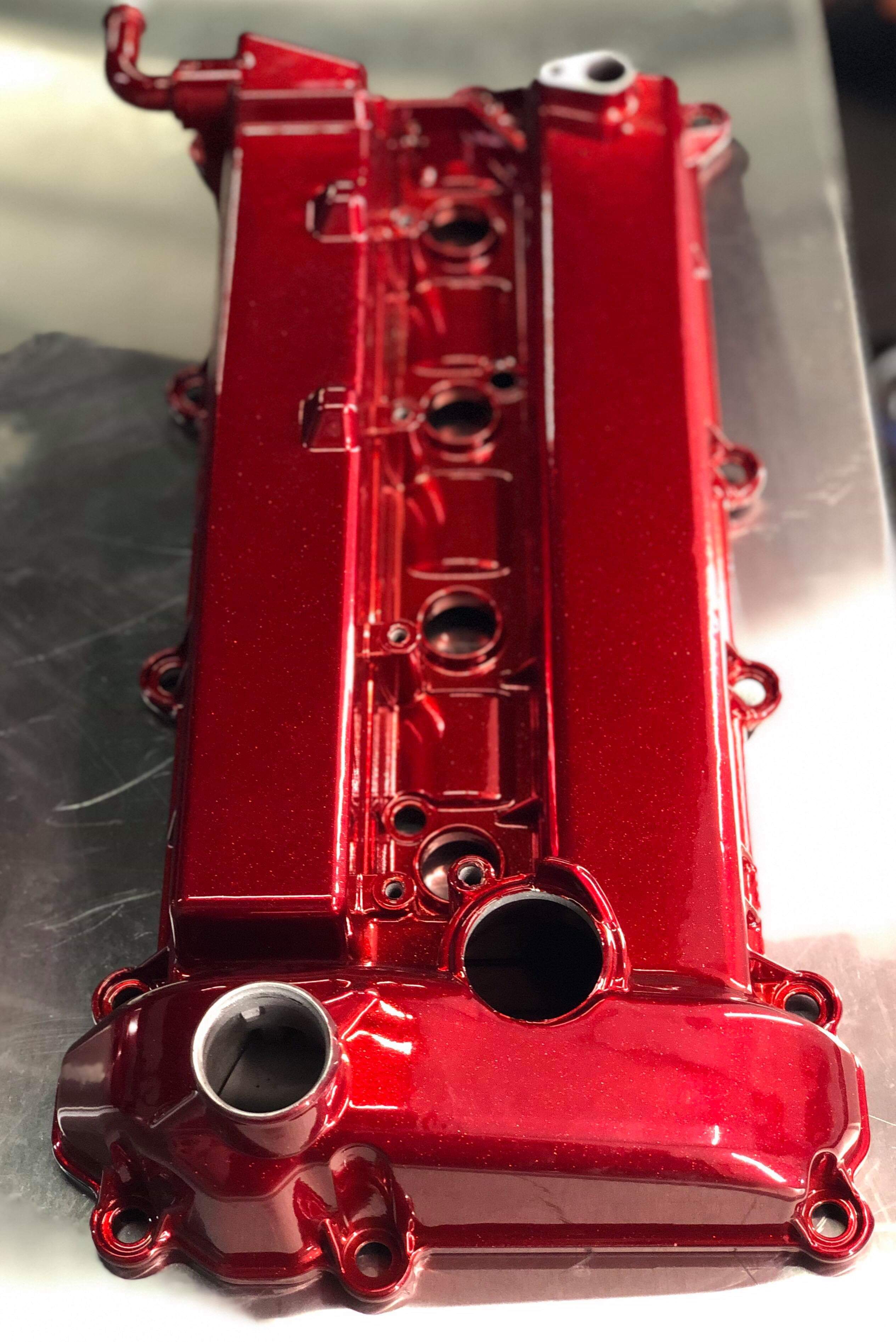 Engine Cover coated with Maroon Gold | Prismatic Powders