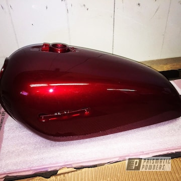 Motorcycle Tank Coated In Illusion Cherry With A Clear Vision Top Coat