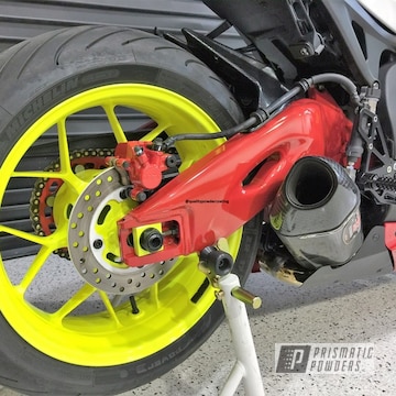 Motorcycle Swing Arm And Wheels Coated In Honda Yellow, Astatic Red And Gloss White