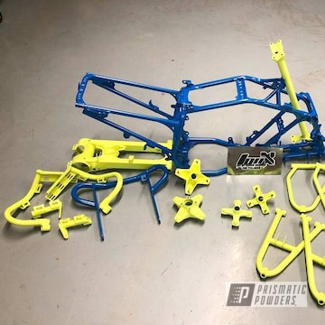 Atv Parts And Frame In A Honda Yellow And Sparks Blue Powder Coat