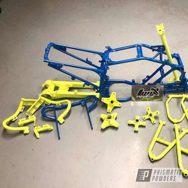 Atv Parts And Frame In A Honda Yellow And Sparks Blue Powder Coat