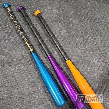 Baseball Bats Powder Coated In Hawaii Blue, Hawaiian Teal, Peacock Sapphire, Super Chrome Plus, Bright Orange And Illusion Violet