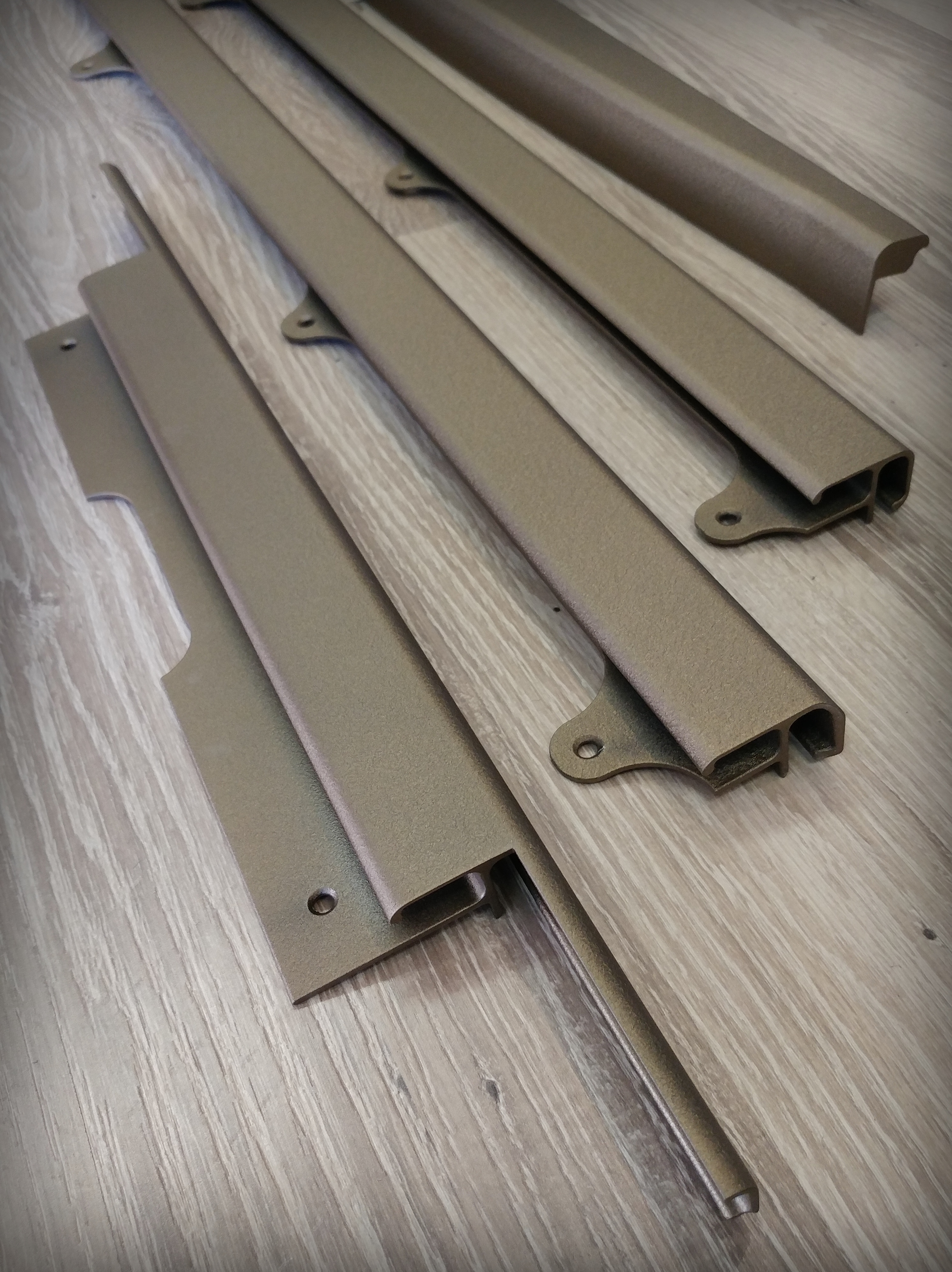 Phenom Aisle Rail featuring Imperial Bronze | Prismatic Powders
