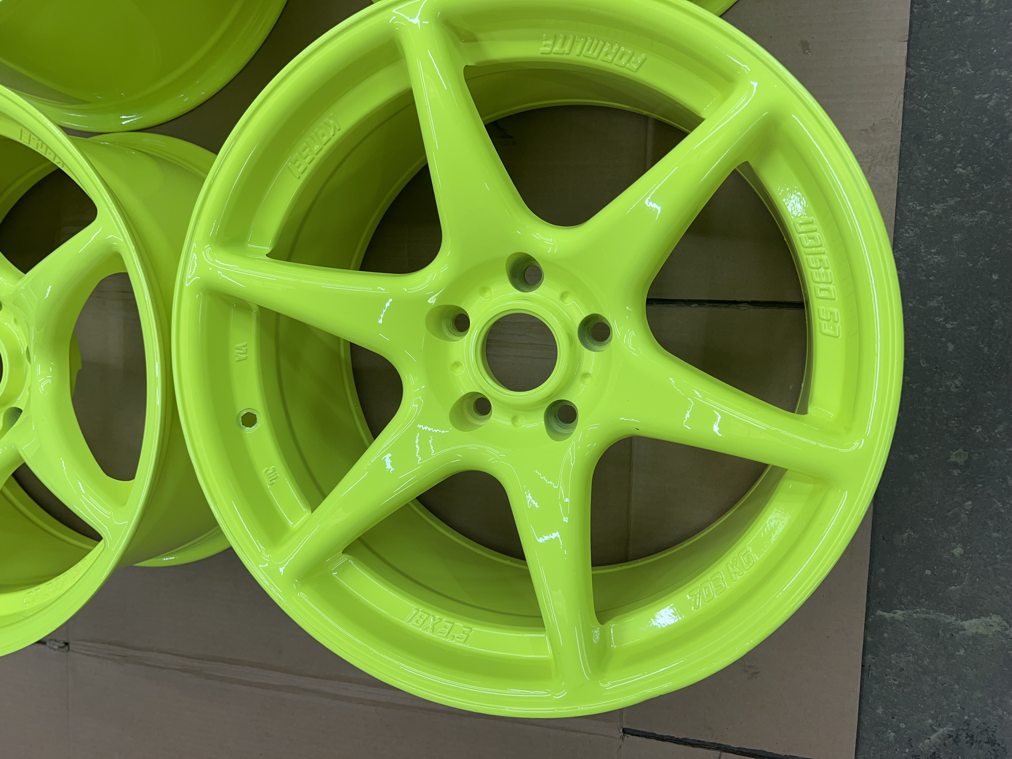 Wheels coated in a Acrylic Clear and Neon Yellow Finish | Prismatic Powders